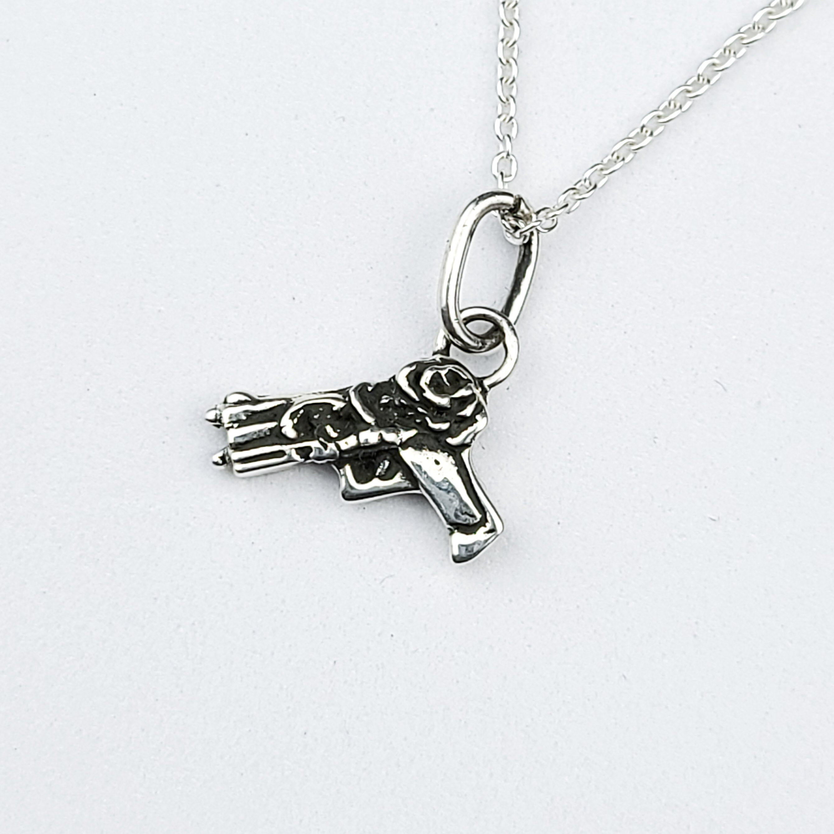 Tiny Silver Gun with Roses Pendant