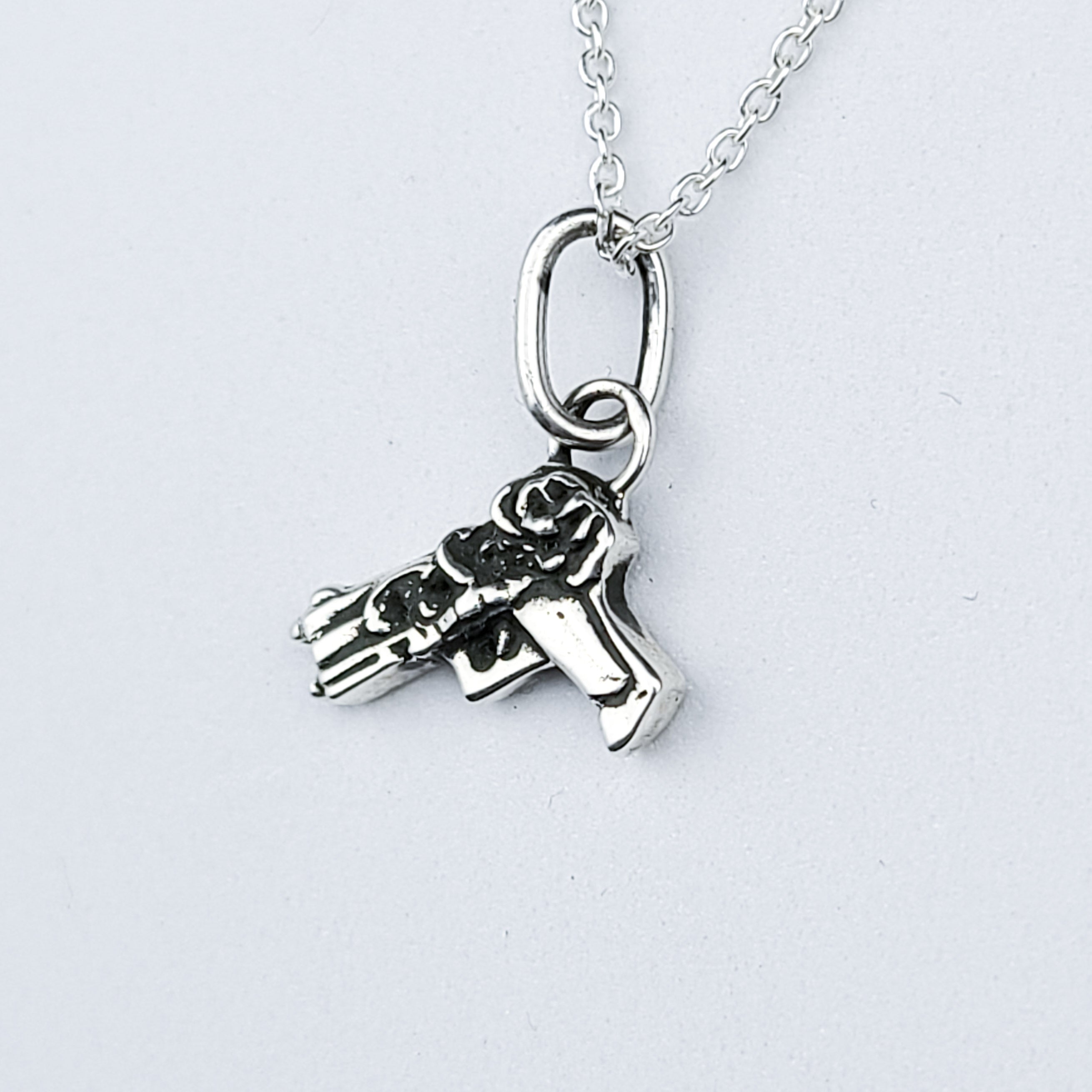 Tiny Silver Gun with Roses Pendant