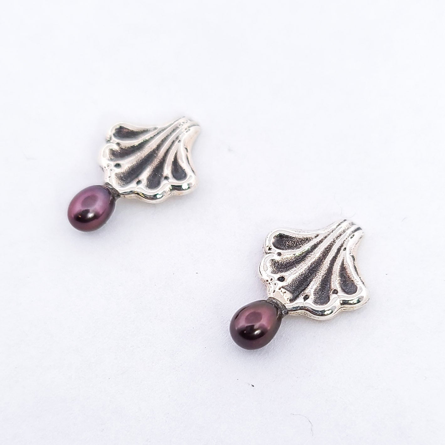Ornate Seashell Earrings with Dark Pearls